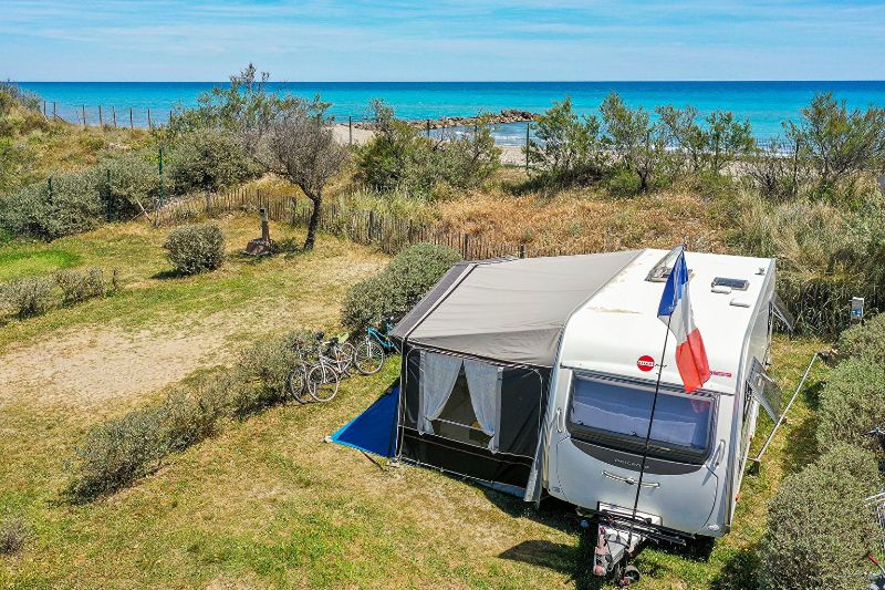 Holiday by the sea on this pitch at Camping Sandaya Les Tamaris