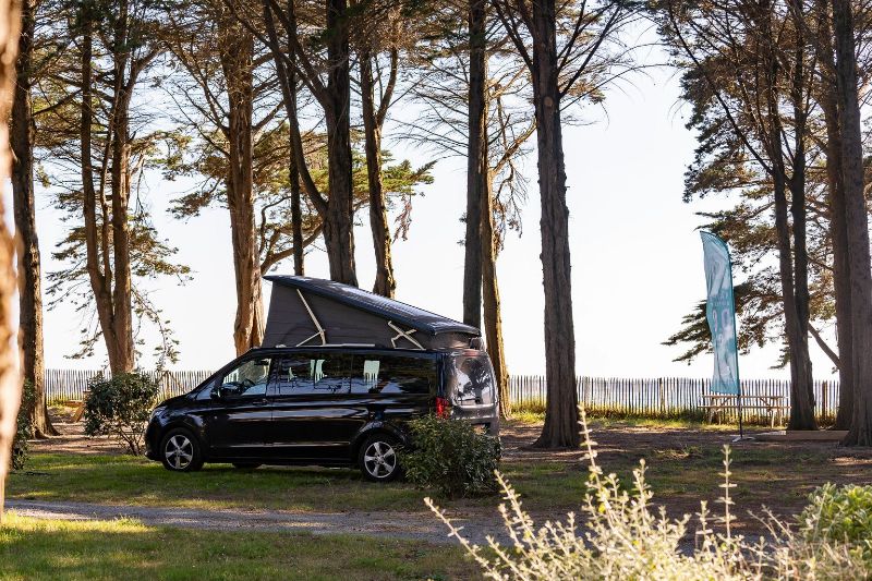 Camper van on a pitch in France by the sea